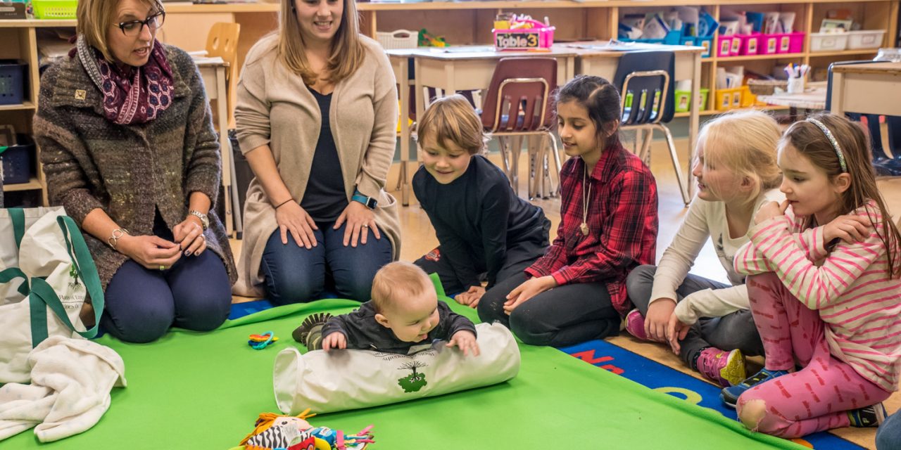 Baby’s visit teaches Grade 2 children about emotions and empathy in successful Roots of Empathy program