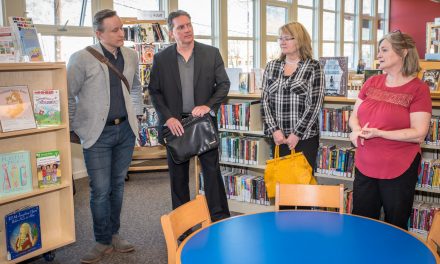 Rotary donation helps buy movable shelving for library