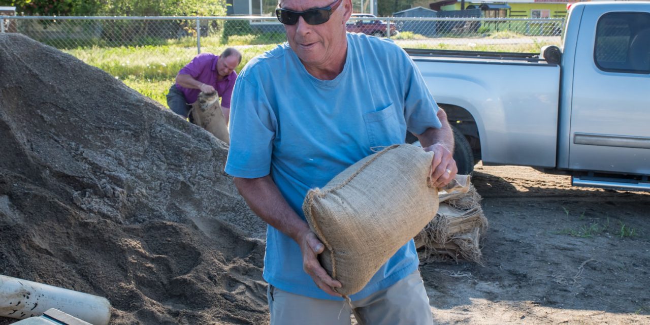 Residents fill sandbags as lake level rises sharply