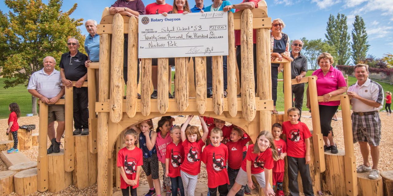 Osoyoos Rotarians present cheque for Osoyoos Elementary natural playground project
