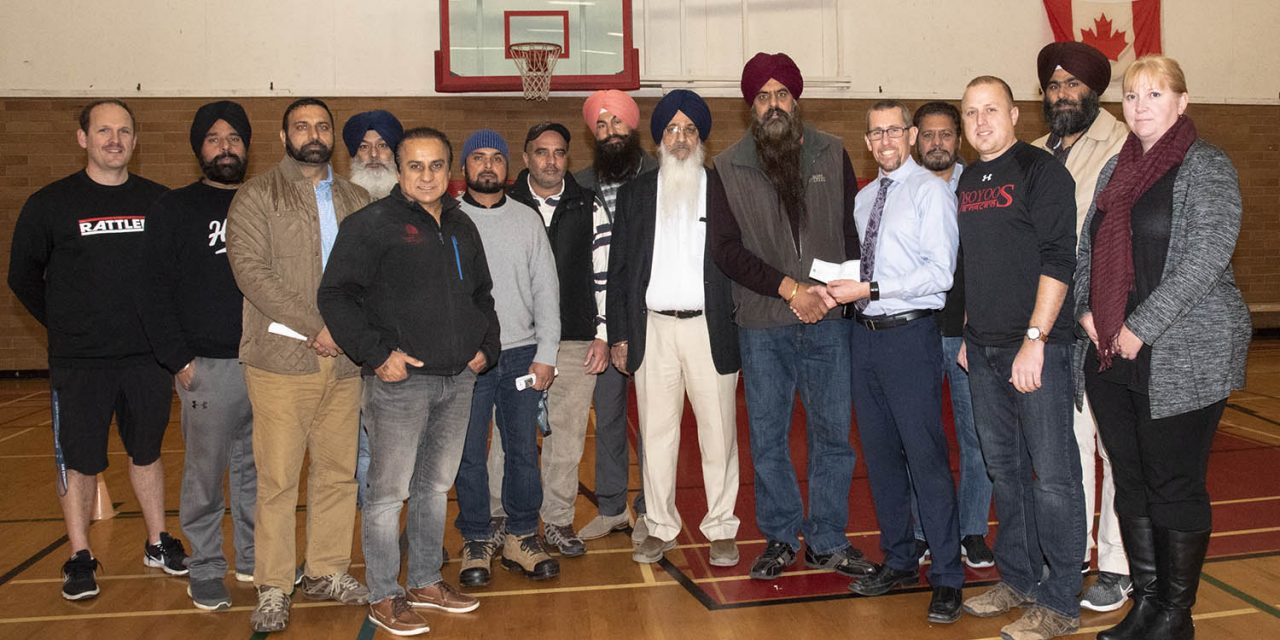 Local Sikhs help OSS get new scoreboard
