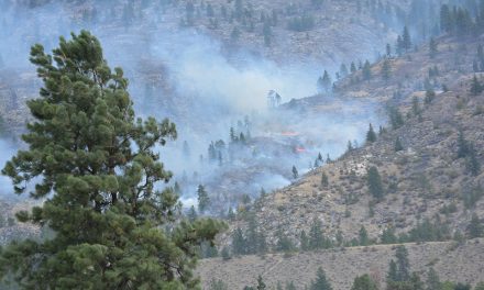 Fire burning away from communities, officials say