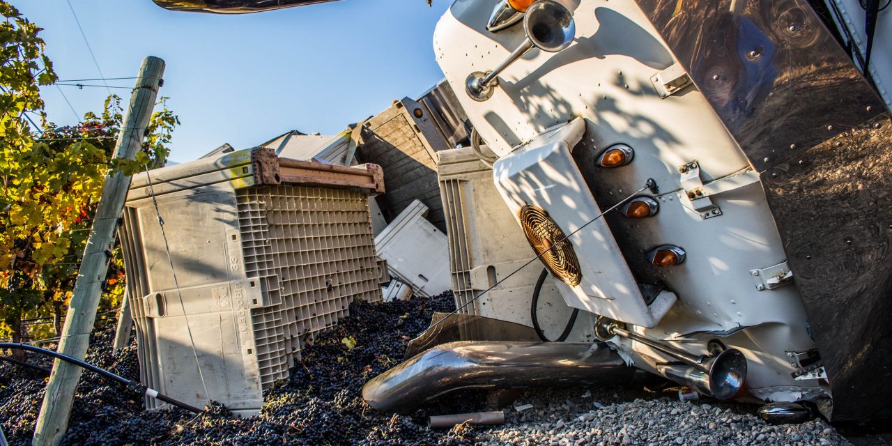 Truck carrying grapes flips on Black Sage Road