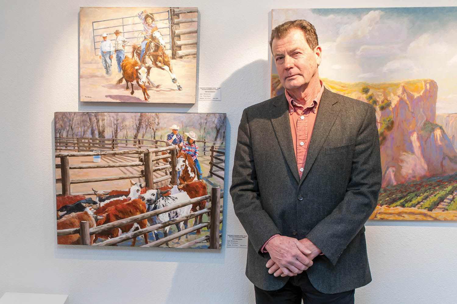 Show organizer Michael Jorden poses with a couple of his western-style paintings in this file photo from last year’s FCA show where he won “best in show.” Jorden’s work will also be in this year’s show along with 20 other artists. (File photo Richard McGuire)