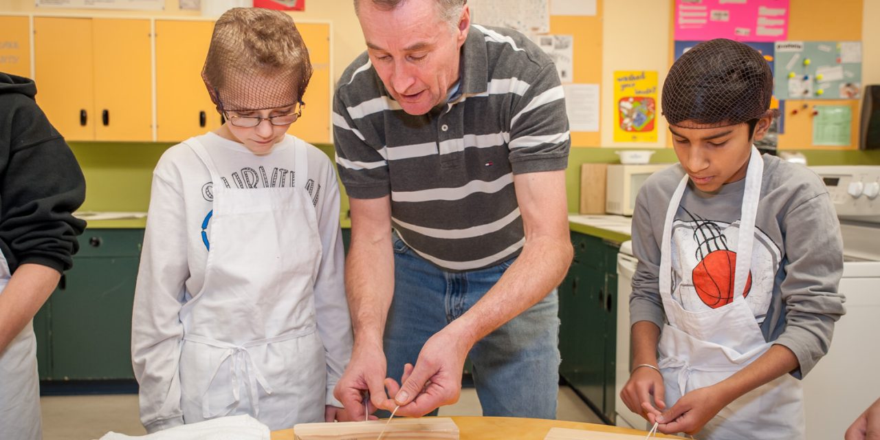 OES students put on hairnets and aprons for introduction to food trades