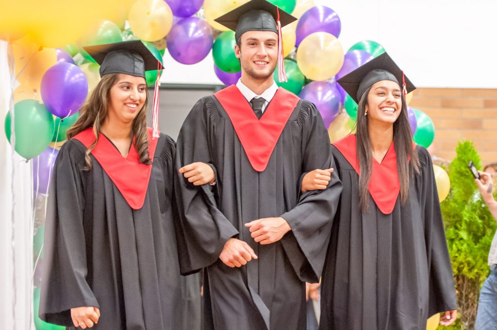 Graduates march past proud parents, friends and relatives to be honoured for their achievements. (Richard McGuire photo)