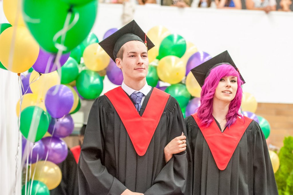 Graduates march past proud parents, friends and relatives to be honoured for their achievements. (Richard McGuire photo)