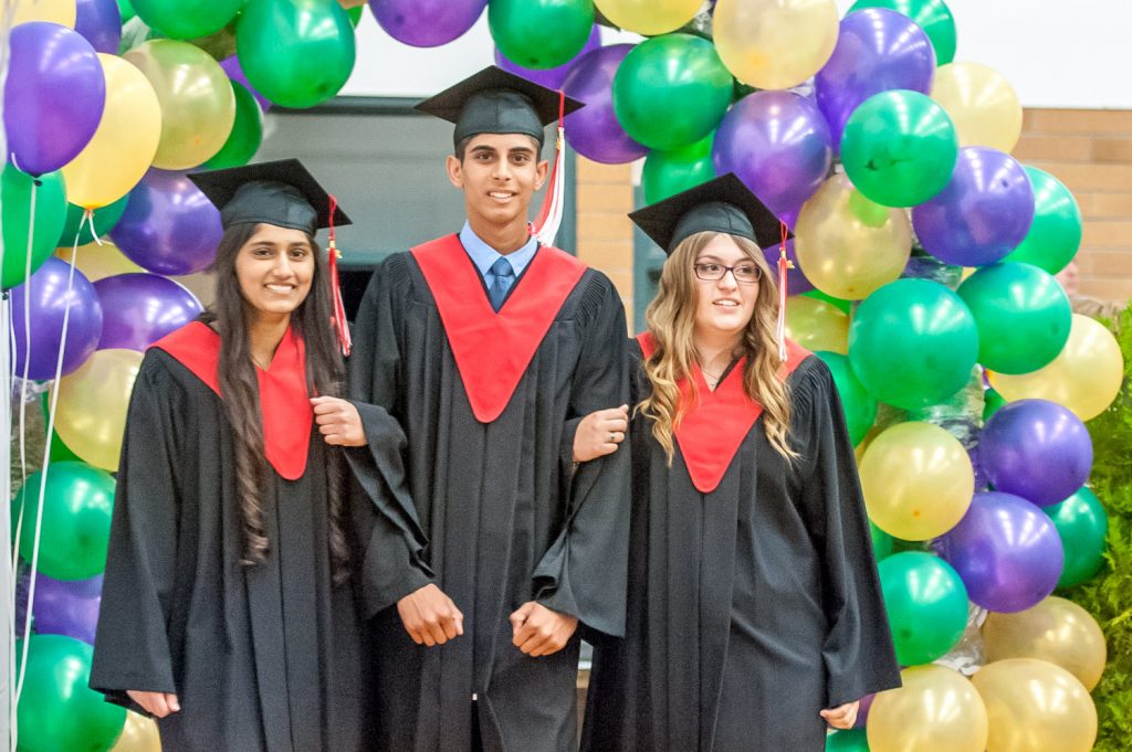 Graduates march past proud parents, friends and relatives to be honoured for their achievements. (Richard McGuire photo)