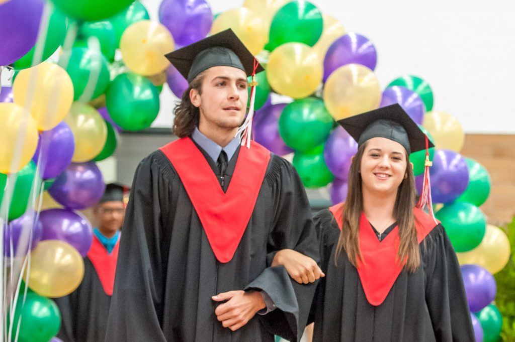 Graduates march past proud parents, friends and relatives to be honoured for their achievements. (Richard McGuire photo)