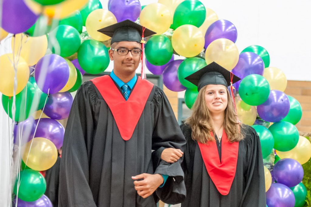 Graduates march past proud parents, friends and relatives to be honoured for their achievements. (Richard McGuire photo)