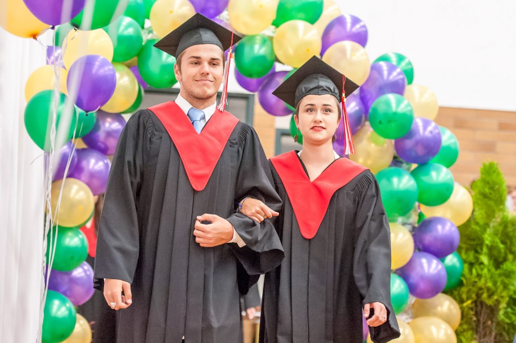Graduates march past proud parents, friends and relatives to be honoured for their achievements. (Richard McGuire photo)
