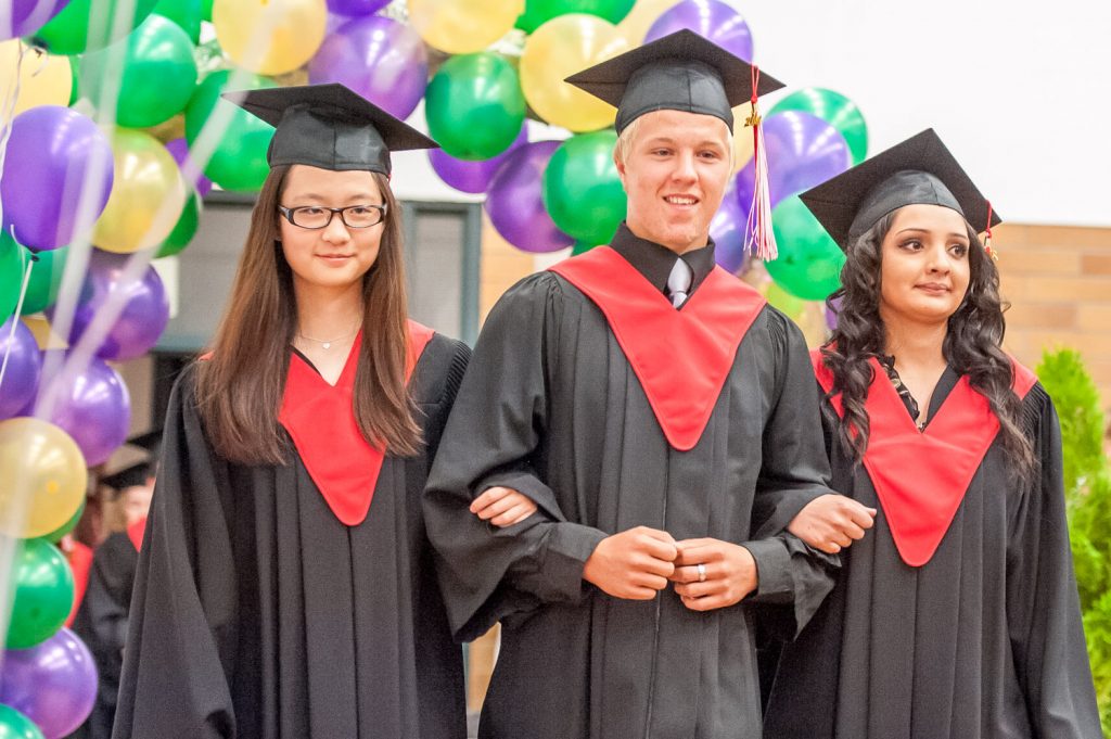 Graduates march past proud parents, friends and relatives to be honoured for their achievements. (Richard McGuire photo)