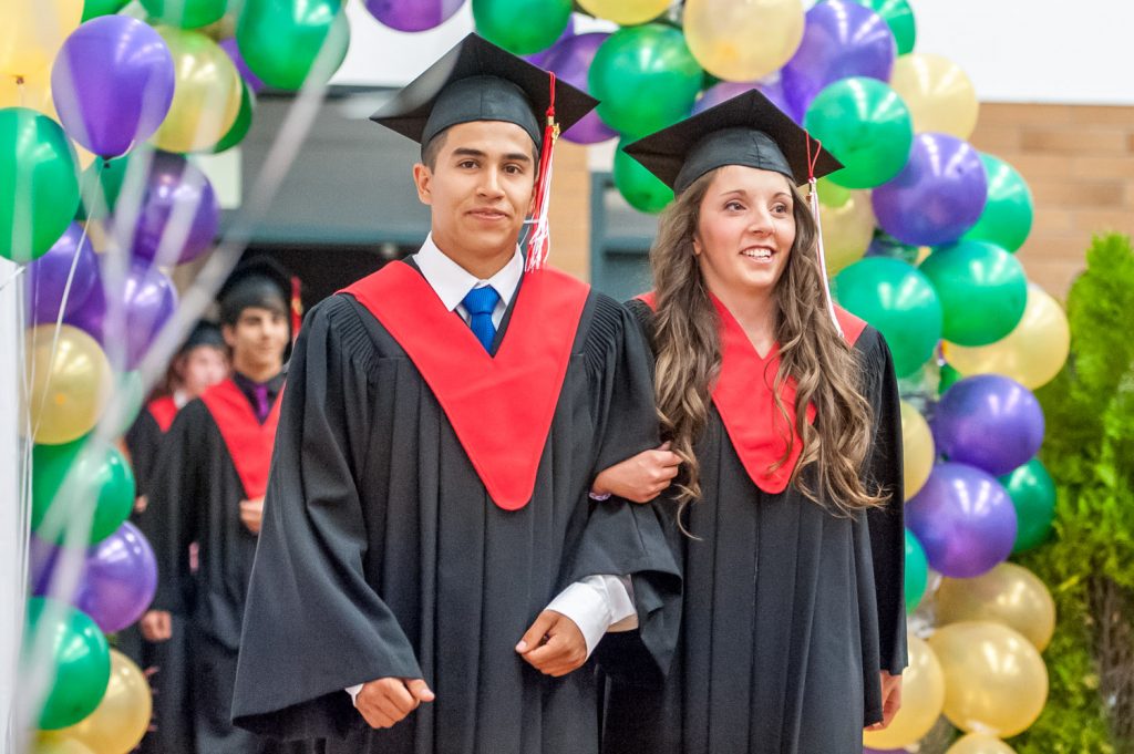 Graduates march past proud parents, friends and relatives to be honoured for their achievements. (Richard McGuire photo)