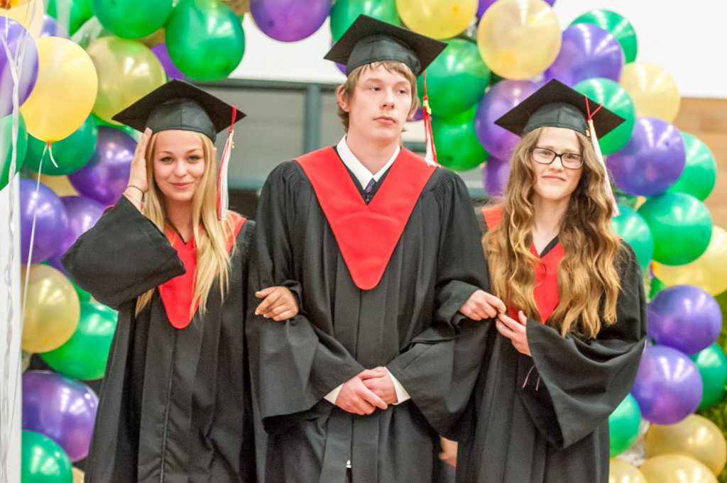 Graduates march past proud parents, friends and relatives to be honoured for their achievements. (Richard McGuire photo)