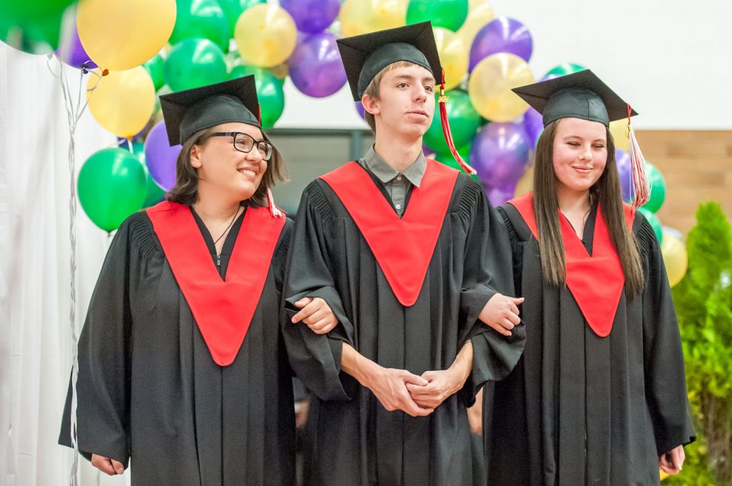 Graduates march past proud parents, friends and relatives to be honoured for their achievements. (Richard McGuire photo)