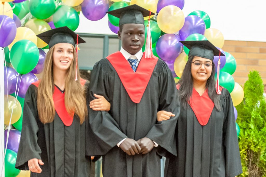 Graduates march past proud parents, friends and relatives to be honoured for their achievements. (Richard McGuire photo)