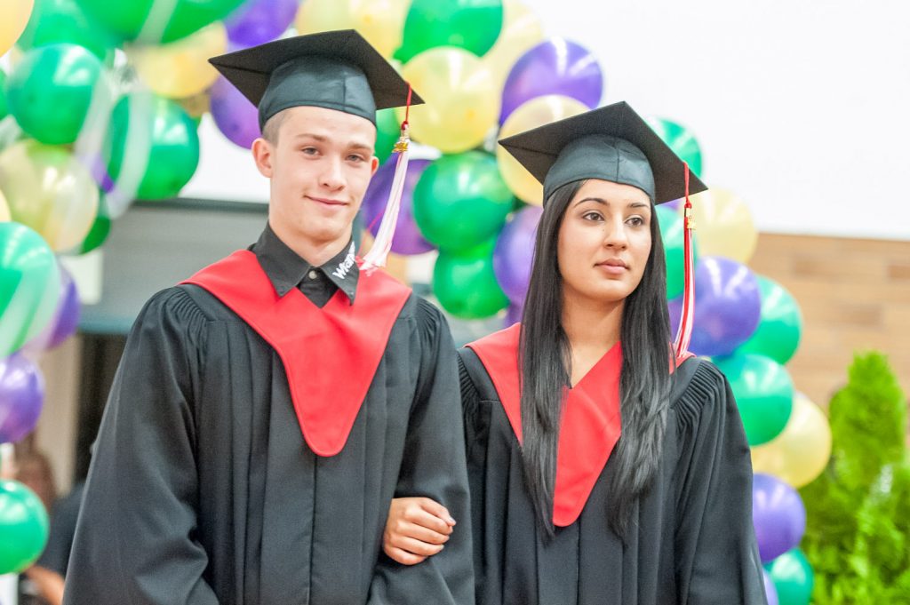 Graduates march past proud parents, friends and relatives to be honoured for their achievements. (Richard McGuire photo)