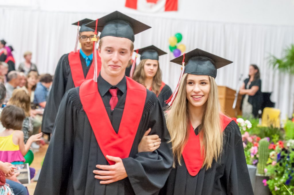 Graduates march past proud parents, friends and relatives to be honoured for their achievements. (Richard McGuire photo)