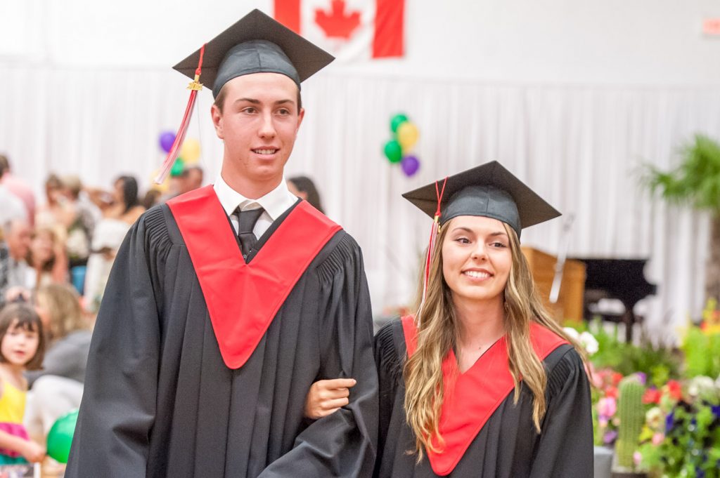 Graduates march past proud parents, friends and relatives to be honoured for their achievements. (Richard McGuire photo)