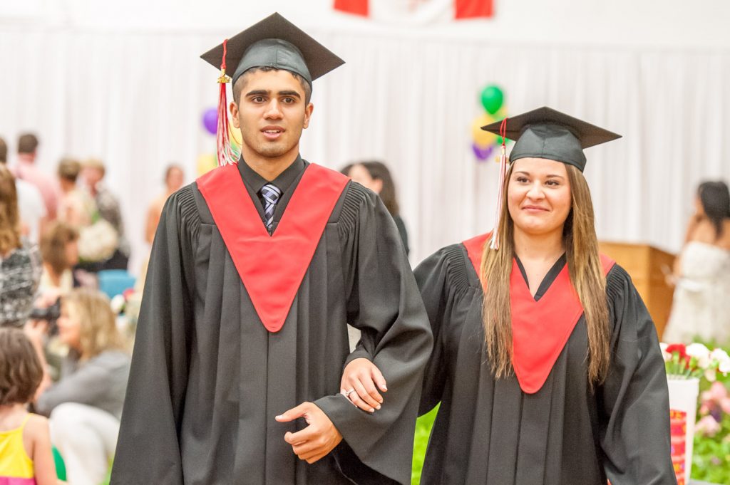 Graduates march past proud parents, friends and relatives to be honoured for their achievements. (Richard McGuire photo)