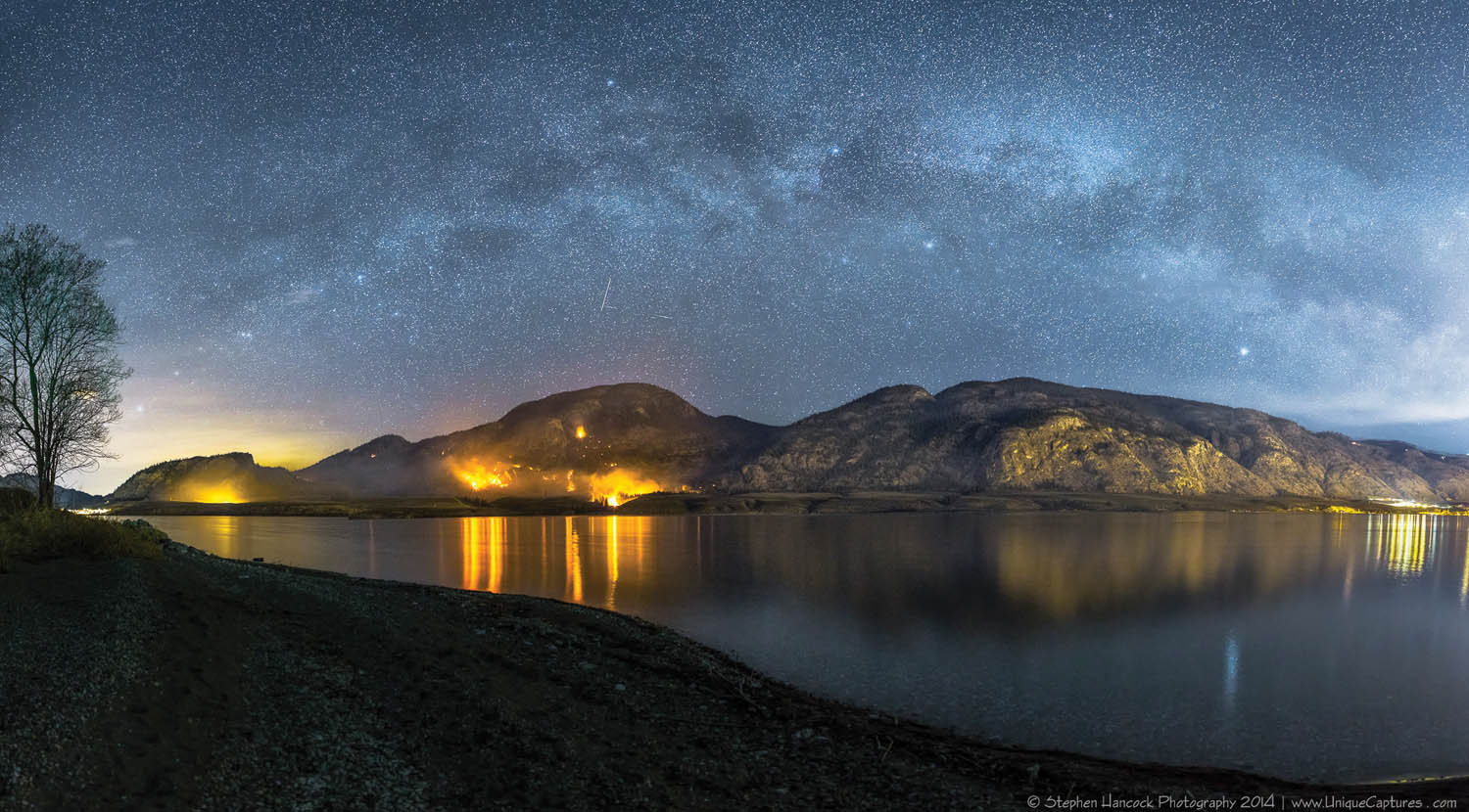 Penticton photographer Stephen Hancock took this nighttime photo of the controlled burn from across the lake. Using long exposures, he took seven different images, which he stitched together using software to make a panorama. The long exposure captures the stars of the Milky Way. (Stephen Hancock Photography)