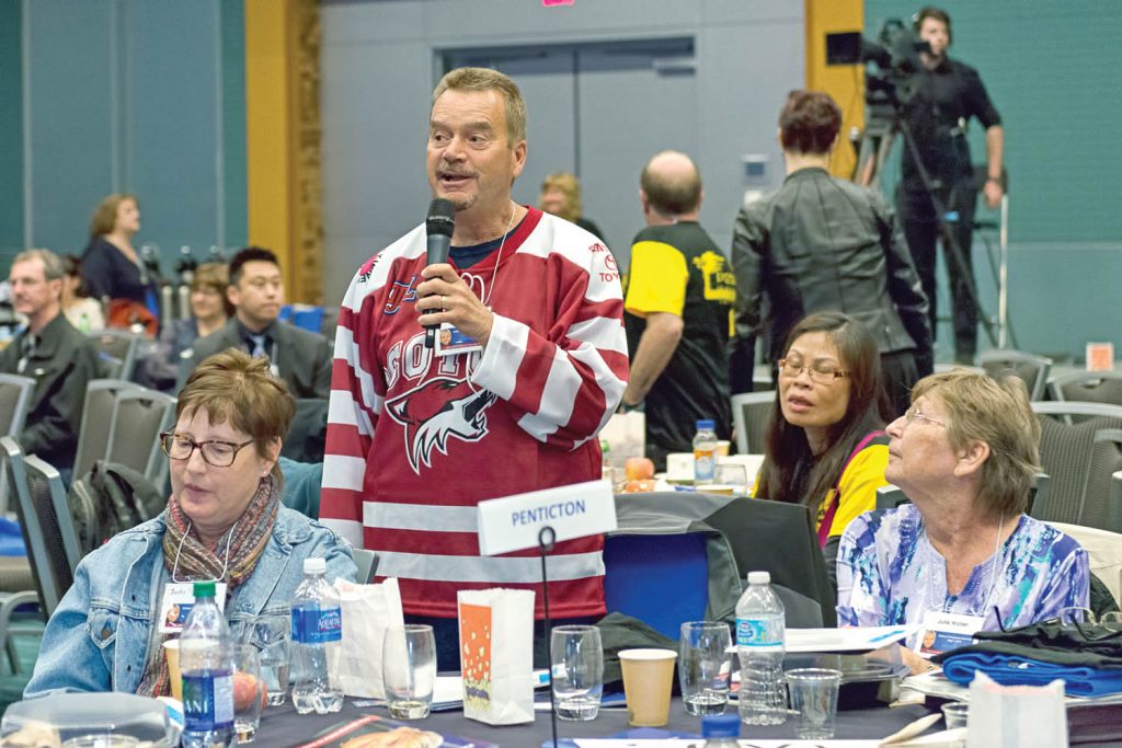 Wearing an Osoyoos Coyotes jersey with the slogan “Be the Kidney,” Brian Rawlings spoke at the Kidney Transplant Summit about Osoyoos Share Your Spare campaign. At left is Judy Sloan, who received a cadaver kidney and at right is Julie Wolter, who received one of Rawlings’ kidneys. (Tracy Riddell photo)