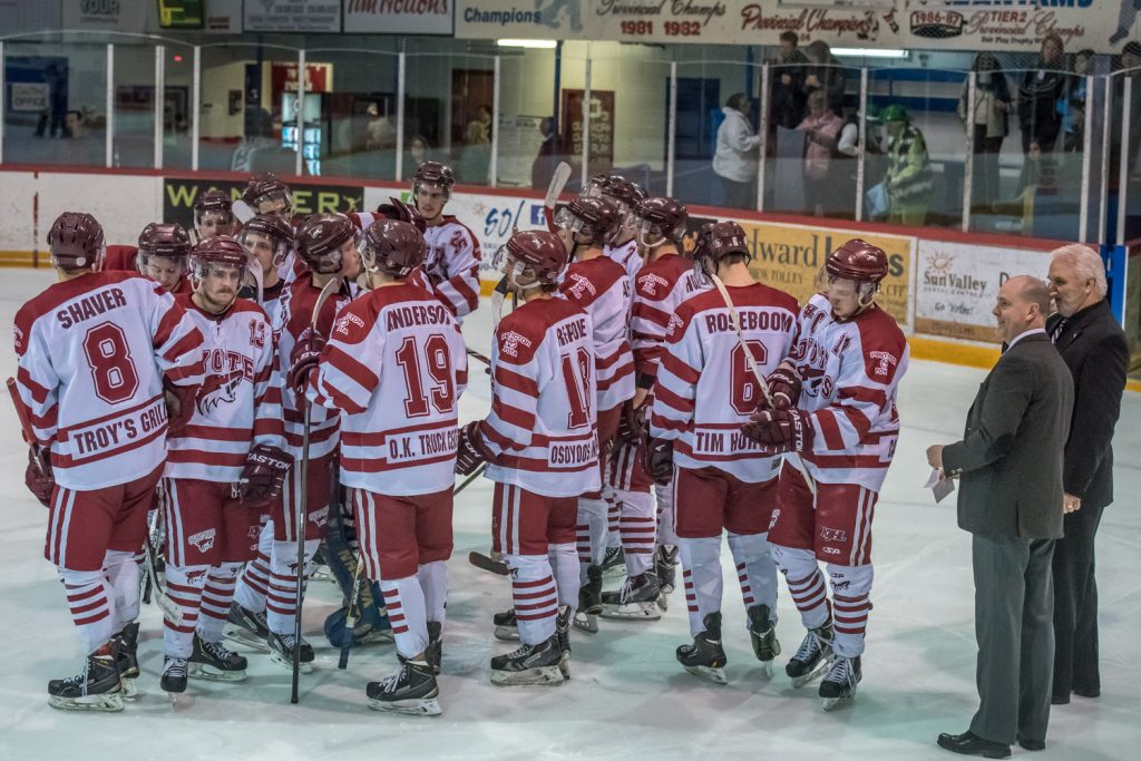Osoyoos Coyote players congratulate each other on a great season, but their disappointment is obvious. (Richard McGuire photo)