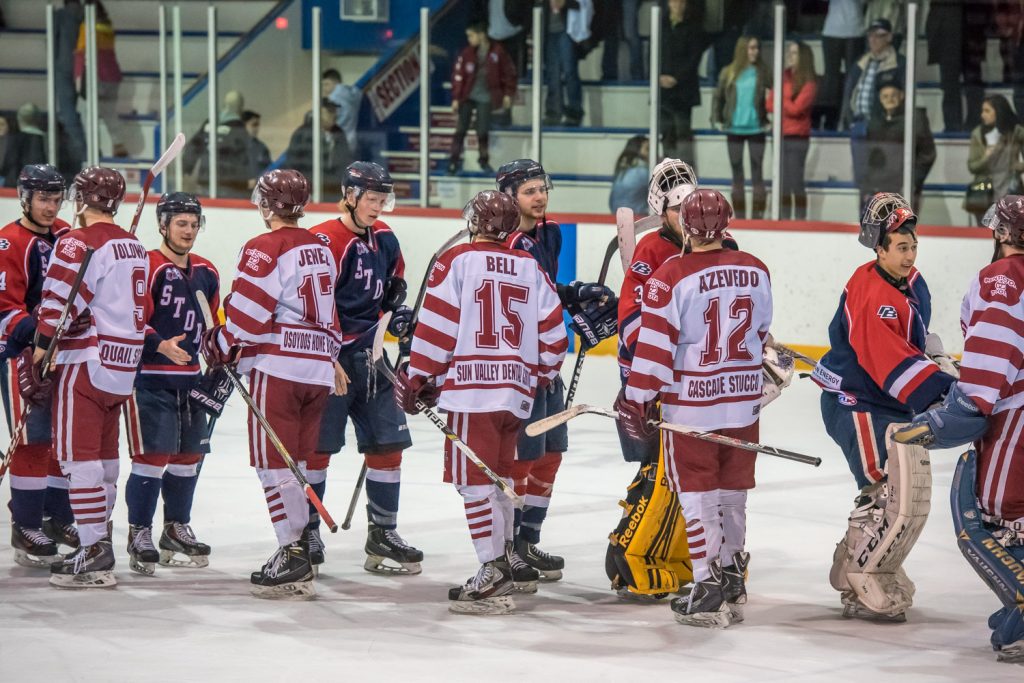 The Kamloops Storm and Osoyoos Coyotes meet at centre ice to offer each other congratulations on a well-played series. (Richard McGuire photo)