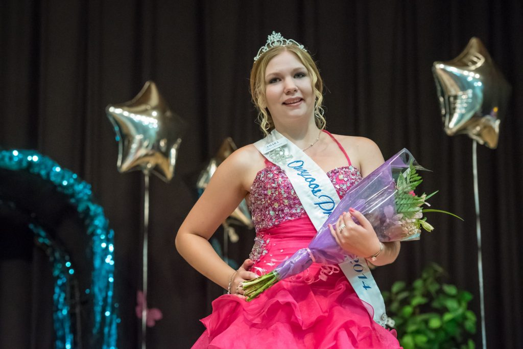 Outgoing Princess Amara Leeson wears her gown and carries flowers. (Richard McGuire photo)