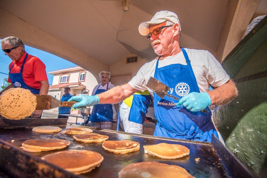 Ron Carr was busy flipping pancakes at the Rotary Pancake Breakfast, which kicked off Wednesday morning at Cherry Fiesta. (Richard McGuire photo)