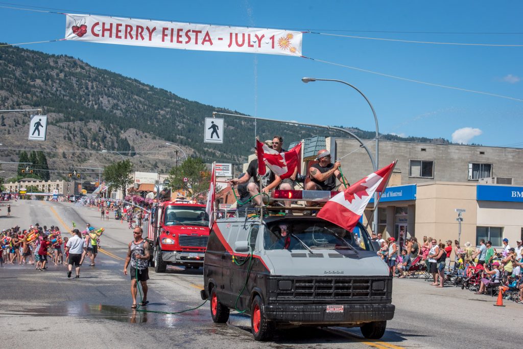 Osoyoos firefighters make their way down Main Street past the attack zone for the water fight, which is in front of Osoyoos Home Hardware. The water fight is a popular highlight of Cherry Fiesta and gets under way just before the parade. (Richard McGuire photo)
