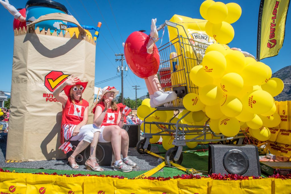 The Buy-Low Foods float was decorated in bright yellow with red and had a giant grocery cart. (Richard McGuire photo)