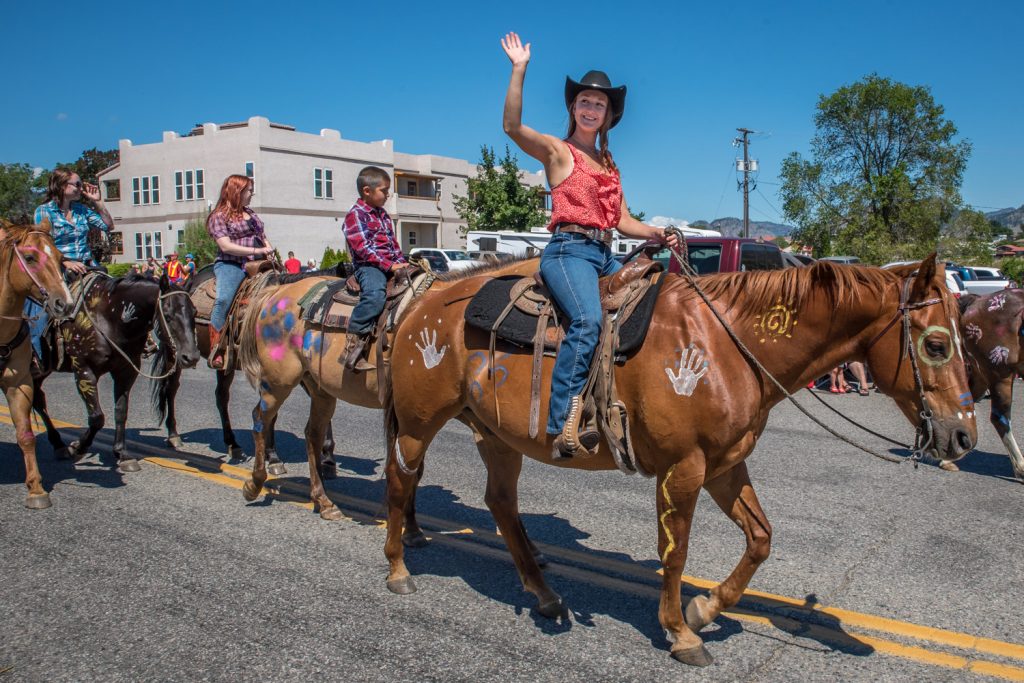 The Cherry Fiesta parade included live horses. Vince Sam, an Osoyoos homeless man, followed with a wheelbarrow and shove to clean up after the horses. (Richard McGuire photo)