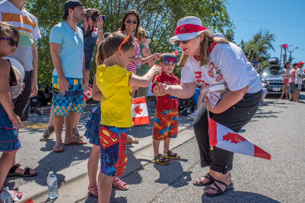Federal Liberal candidate Connie Denesiuk reached out to young future voters in the Cherry Fiesta parade. (Richard McGuire photo)