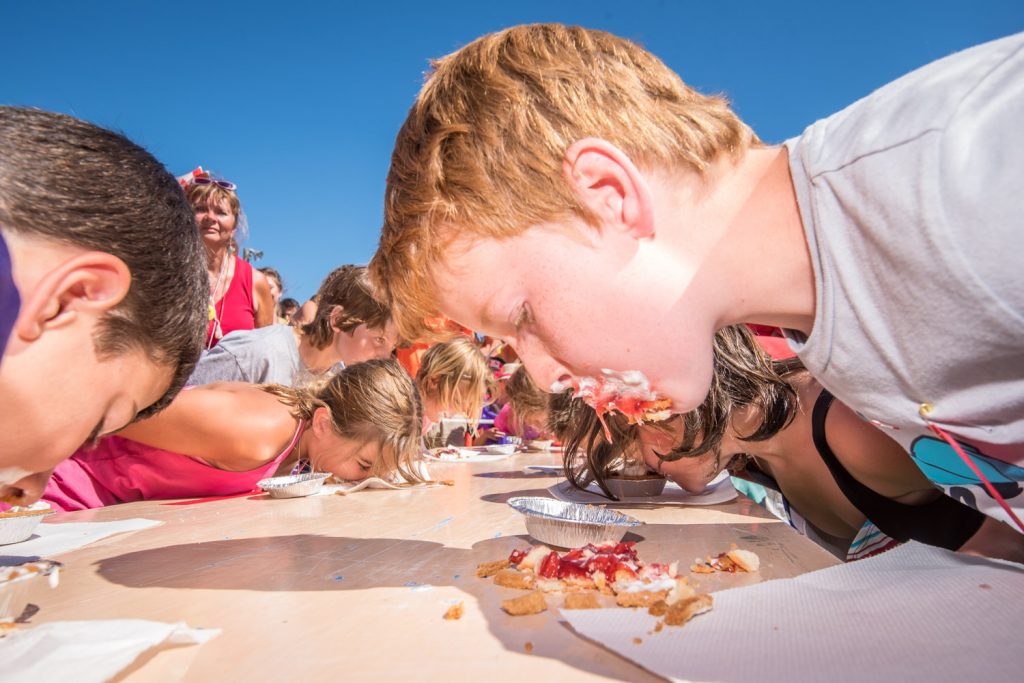Bronson Macdonald, of Brooks, Alta., covered his face with cherry pie as he wolfed it down in the cherry pie eating contest at Cherry Fiesta. (Richard McGuire photo)
