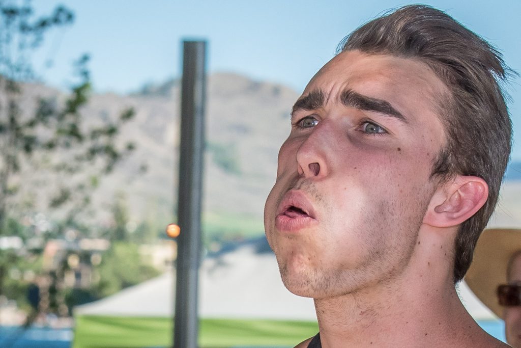 It was all in the concentration as Mitchell Sartori, of North Vancouver, fired off a cherry pit in the spitting contest at Cherry Fiesta. (Richard McGuire photo)