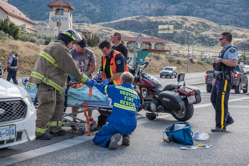 A man was taken away by ambulance after the motorcycle he was riding was involved in a collision at Highways 97 and 3. The accident occurred around 5 p.m. Wednesday. The motorcycle had an Alberta plate. It appeared the other vehicle was an SUV. RCMP directed traffic while Osoyoos Fire Department and BC Ambulance personnel attended to the victim. Information about the cause of accident and the extent of the injured man's injuries is not currently available. (Richard McGuire photo)
