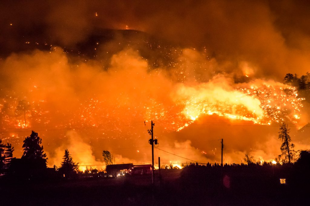Many homes were threatened by the advancing Testalinden fire just west of Highway 97. This photo was taken just before 10 p.m. Friday. (Richard McGuire photo)