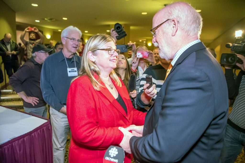 Liberal candidate Connie Denesiuk visited winner Richard Cannings of the NDP as he made his way to a room of supporters. The two held parties for their supporters in different rooms at the Penticton Lakeshore Resort, Hotel and Convention Centre. (Richard McGuire photo)