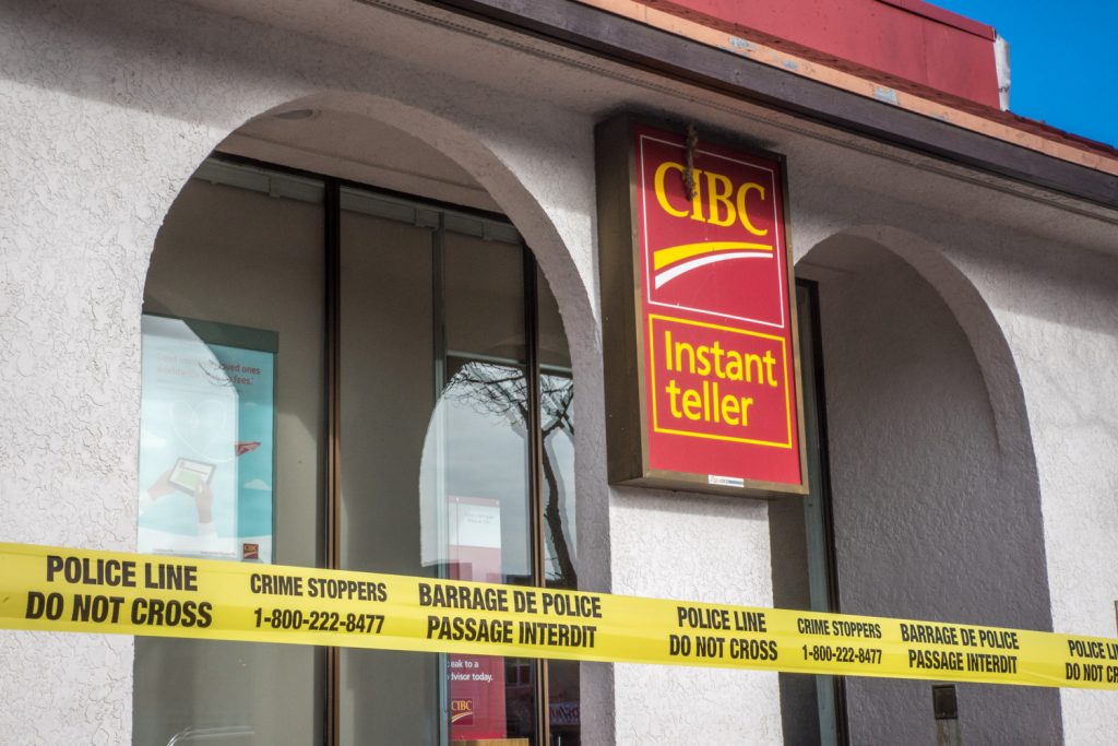 Osoyoos RCMP briefly evacuated CIBC and two neighbouring businesses Tuesday morning after a suspicious duffle bag was found tied to a railing at the back of the bank. The businesses reopened after the police determined the bag only contained garbage. (Richard McGuire photo)