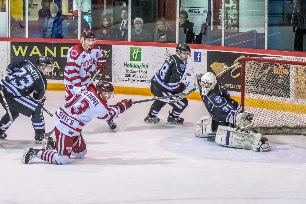 Coyote Jackson Glimpel fell to his knees, but he managed to fire a shot that sailed just over the pad of Knights goalie Daniel Paul. The goal late in the second period of Wednesday night's game put the Coyotes ahead 3-2. Both teams got a goal each in the final period giving the Coyotes a 4-3 win. (Richard McGuire photo)