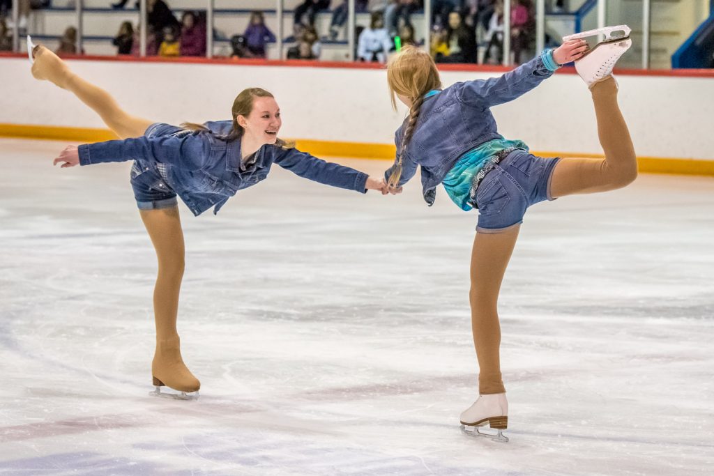 Lindsay Koepke, left, and Emily Stewart performed a duet to Sweet Home Alabama. They shed their staw hats for this part of the performance. (Richard McGuire photo)