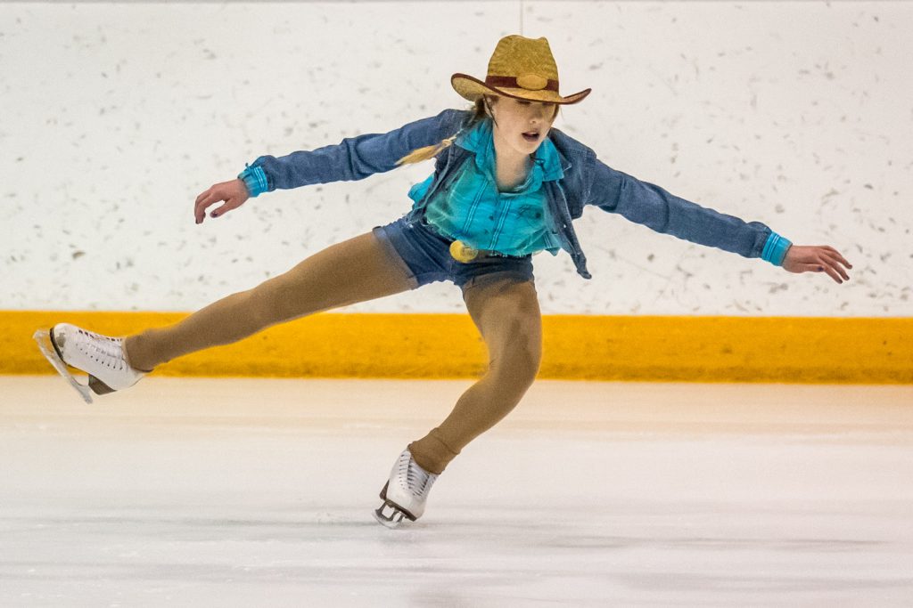 Emily Stewart wears a straw hat during a duet with Linday Koepke to Sweet Home Alabama. (Richard McGuire photo)