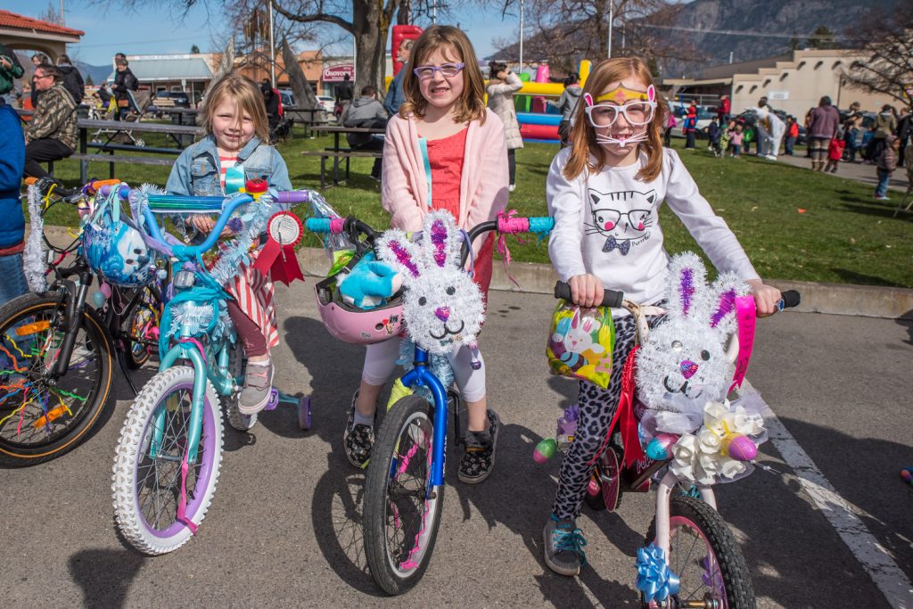 These girls took home ribbons for their beautifully decorated bikes in the Kiwanis Bike and Trike judging. From left are Alexis Strumpski, 4, and Kendra Strumpski, 7, both of Miday, and Trinity Marty, 7, of Edmonton. (Richard McGuire photo)