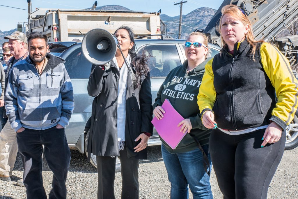Kuldeep Rai takes the megaphone to address the many Indo-Canadians who turned out in Punjabi. (Richard McGuire photo)
