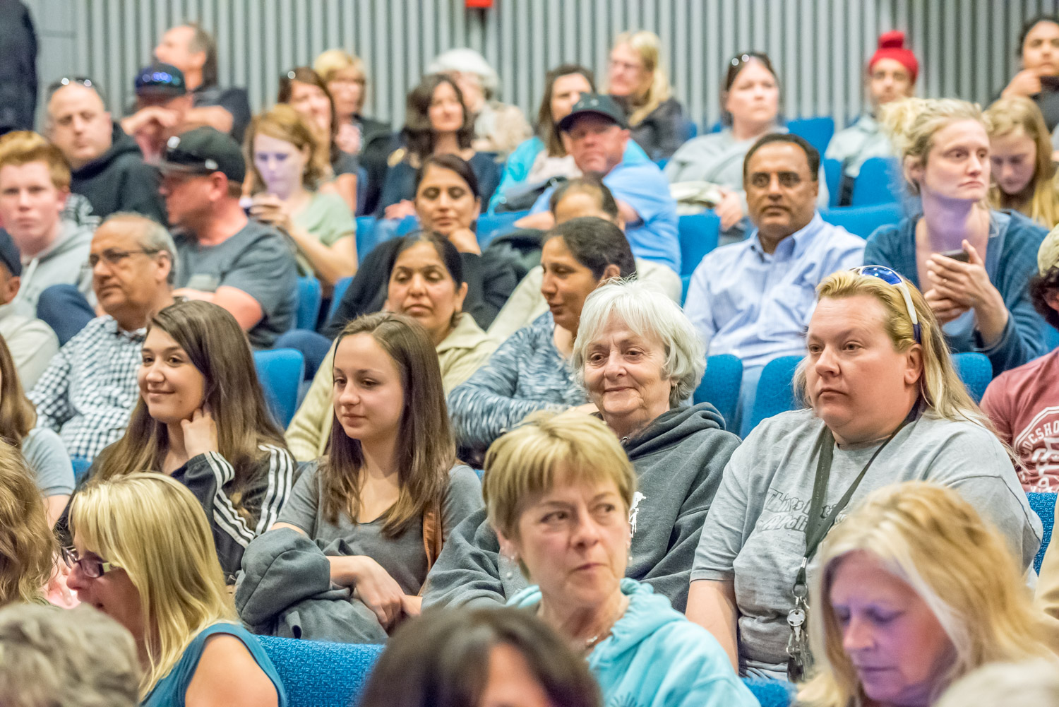 Members of the Osoyoos community wait in nervous anticipation for the meeting to start. They packed the Osoyoos Community Theatre at OSS and many waited outside. (Richard McGuire photo)