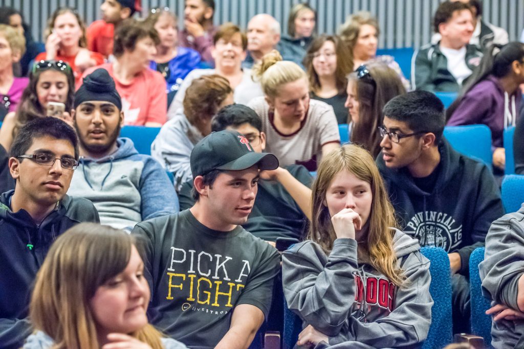 Members of the Osoyoos community wait in nervous anticipation for the meeting to start. They packed the Osoyoos Community Theatre at OSS and many waited outside. (Richard McGuire photo)