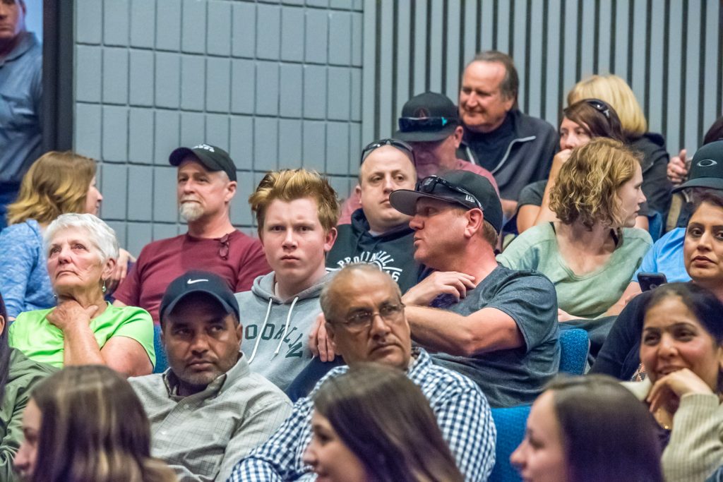 Members of the Osoyoos community wait in nervous anticipation for the meeting to start. They packed the Osoyoos Community Theatre at OSS and many waited outside. (Richard McGuire photo)