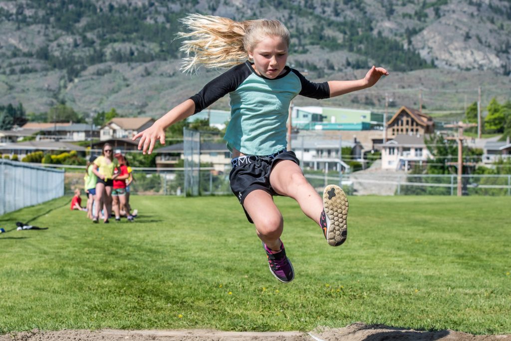 Paige Kaminski, a Grade 4 student at Osoyoos Elementary School, takes a flying leap in long jumping. The school's students had their track and field day Friday. Watch for more photos in the Osoyoos Times and on OsoyoosTimes.com. (Richard McGuire photo)