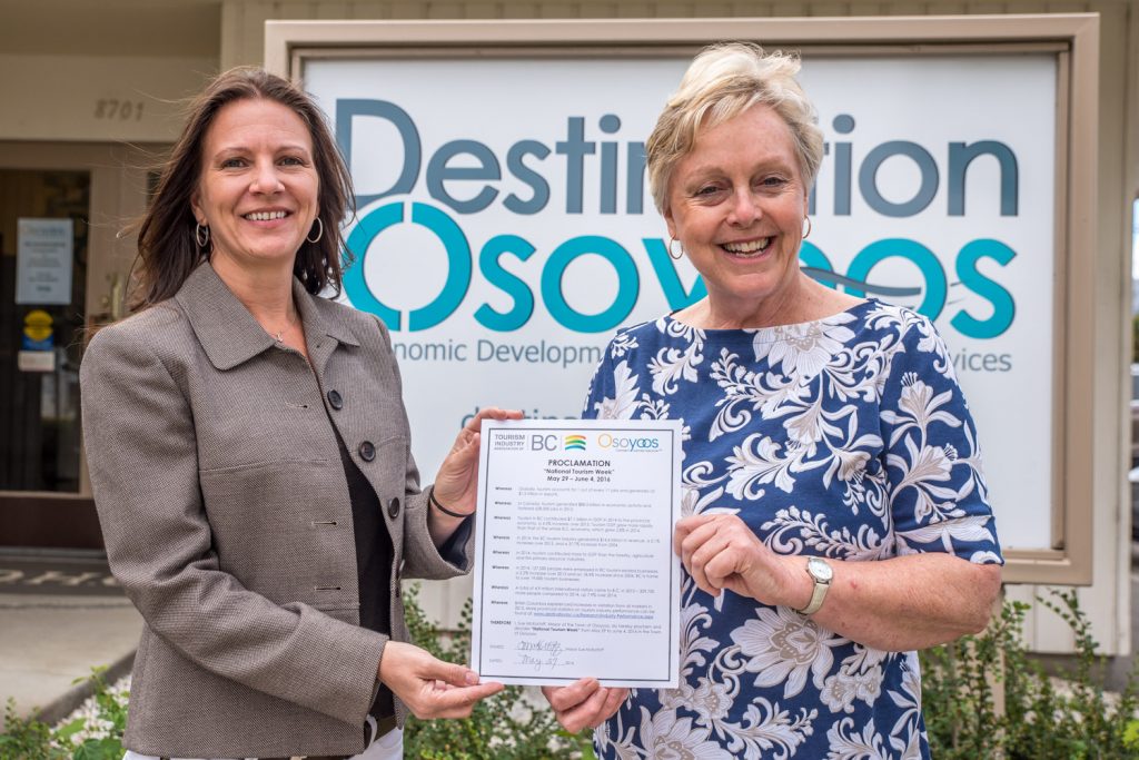 Mayor Sue McKortoff (right) issued a proclamation on Friday recognizing the week of May 29 to June 4 as "National Tourism Week" in Osoyoos. With her was Darlene Richard, marketing manager with Destination Osoyoos. In her proclamation, McKortoff pointed out that in 2014, the B.C. tourism industry generated $14.6 billion in revenue. She also noted the vital importance of tourism to Osoyoos. (Richard McGuire photo)